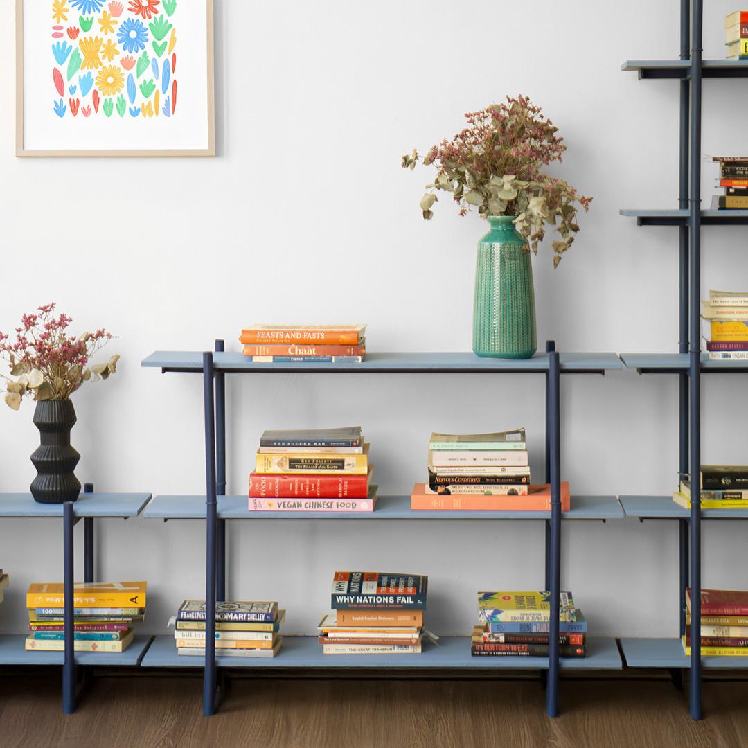 Modular shelving system showing infinite expandability — stack vertically, extend horizontally, turn corners